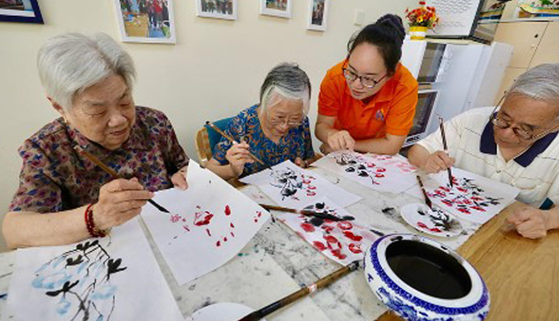 photograph showing seniors in painting class